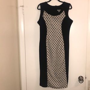 A fitted black and white dress